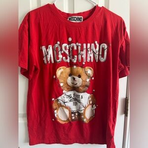 Red bear shirt, adorned with small colorful lights.